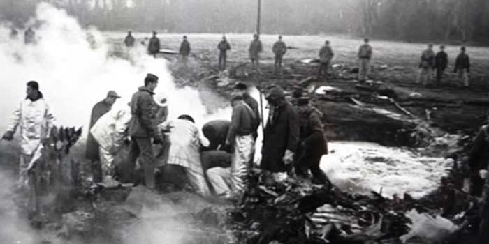 Crew members gathered around the site of a fallen Mark 39 thermonuclear bomb