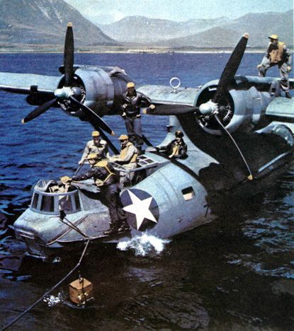 Crew members aboard a PBY Catalina
