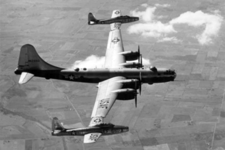 Boeing B-29 in the air with two Republic F-84 Thunderjets