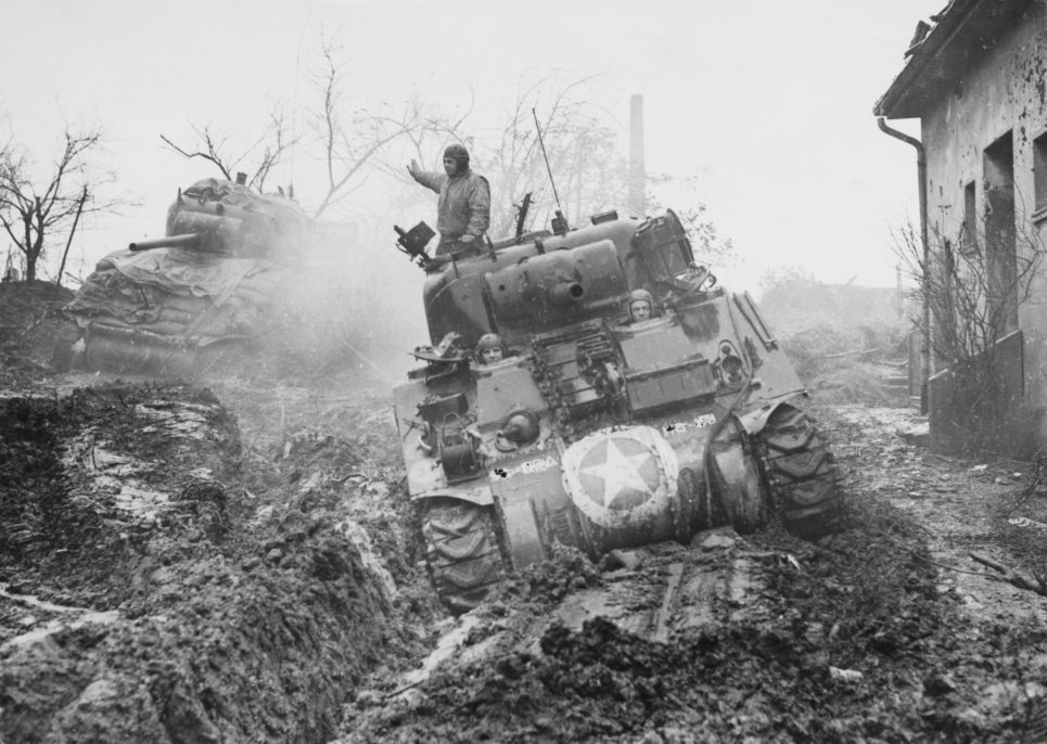 M4 Sherman tanks from the 8th Armoured Division of United States 9th Army advance through the mud into the town of Geilenkirchen during Operation Clipper on 19th November 1944 in the North Rhine-Westphalia region of Germany.  (Photo by Fred Ramage/Keystone/Hulton Archive/Getty Images).