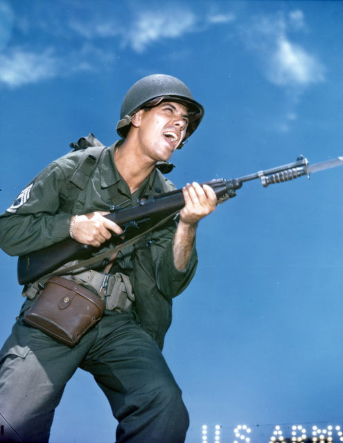 Technical Sergeant Richard S. Westhoven holding an M1 Carbine rifle