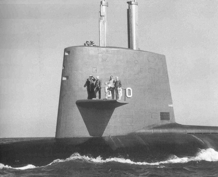 Admiral Rickover and others waiting on the wings of the USS Sculpin while at sea