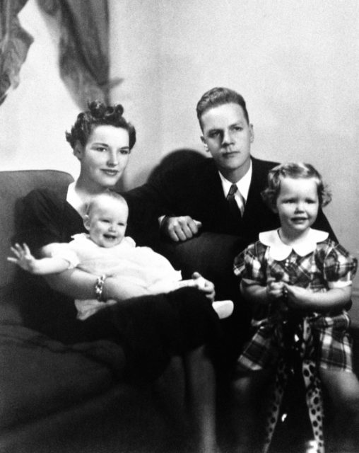 Alexander Bonnyman Jr. sits for a photo with his wife and two children