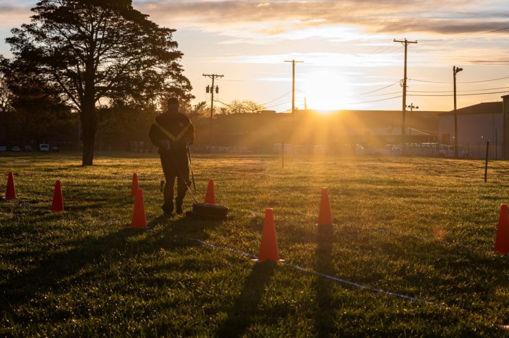 US Army soldier running through a course