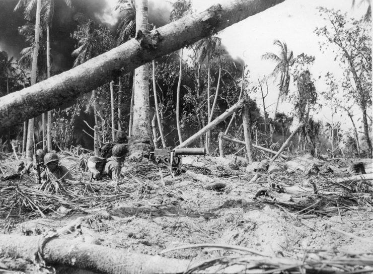 7th Infantry Division soldiers sitting in a foxhole