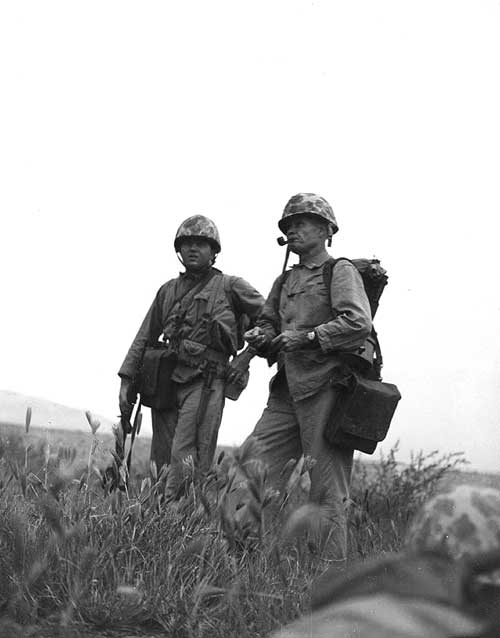 Chesty Puller and another US Marine studying terrain