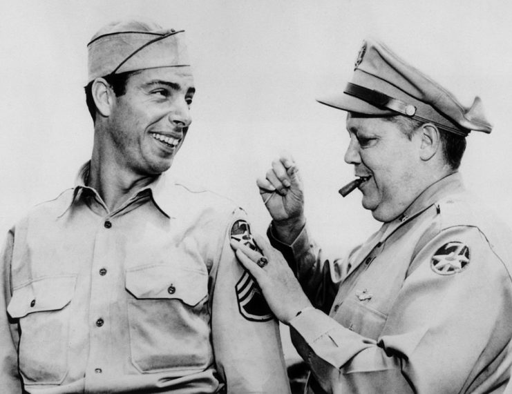 Joe DiMaggio receiving a patch while serving in the US Army 