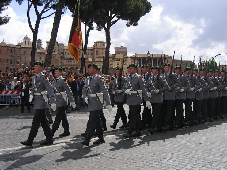 German Wachbataillon soldiers marching with Mauser Karabiner 98k rifles