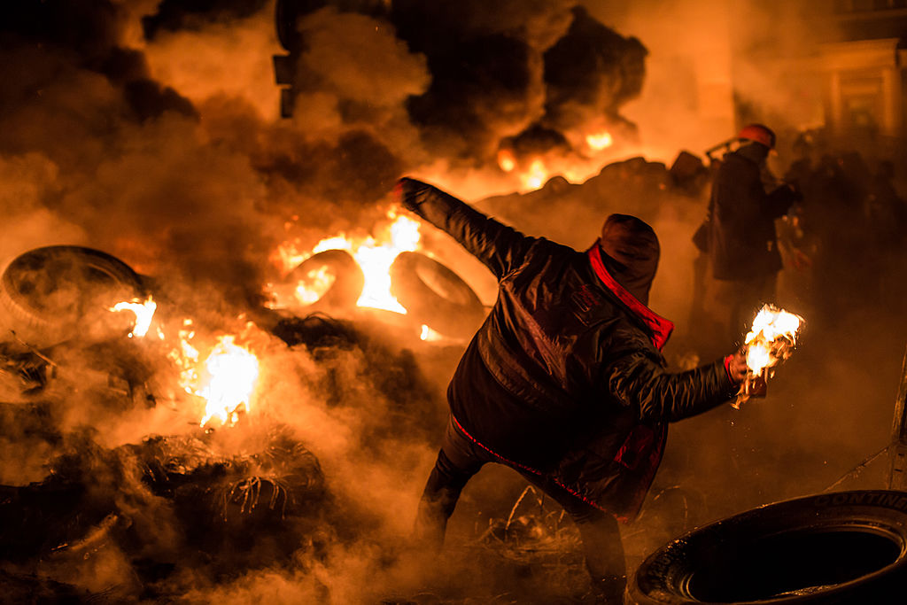 A protester throws a Molotov cocktail in Kiev, Ukraine in 2014