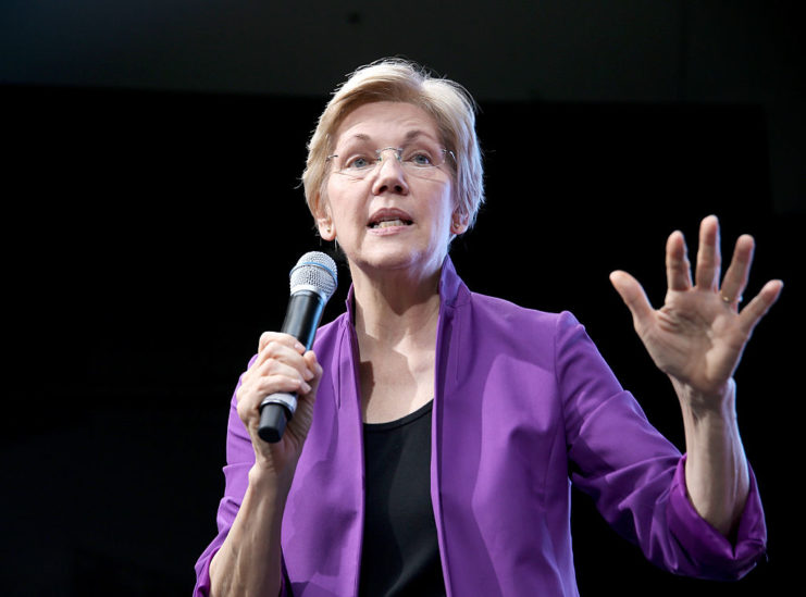 Elizabeth Warren speaking into a microphone