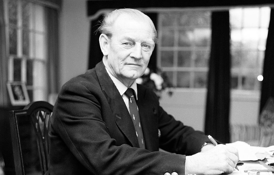 John "Mad Jack" Churchill sitting at a desk