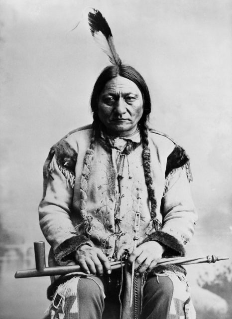 Sitting Bull holding a peace pipe 