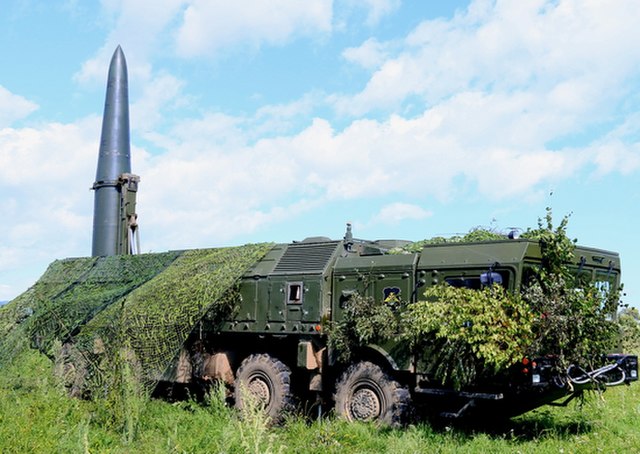 Iskander-M camouflaged with moss and vegetation