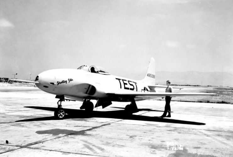 Pilot standing next to a P-80 Shooting Star test plane