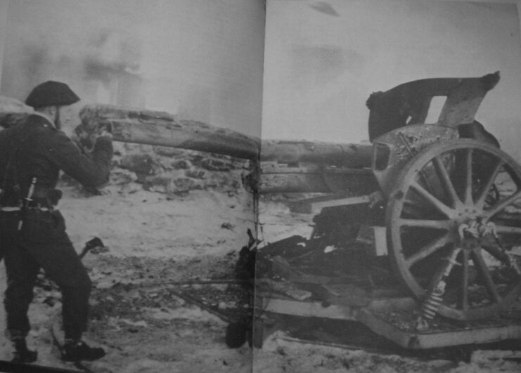 John "Mad Jack" Churchill staring down the barrel of 75 mm Belgian field gun in the middle of a battlefield