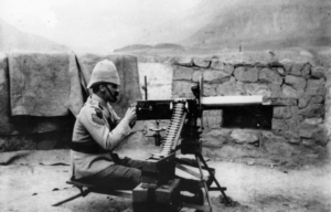 Soldier aiming a Maxim gun