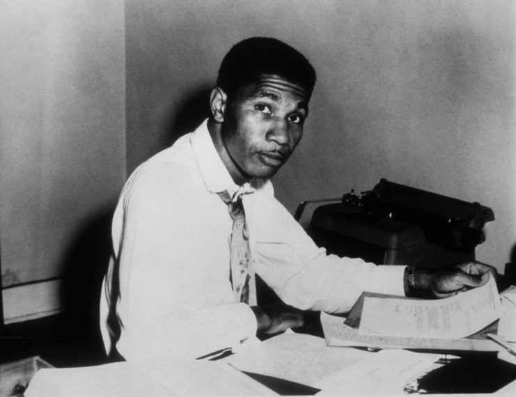 Civil Rights Activist Medgar Evers poses for a picture at his desk in the early 1960's 