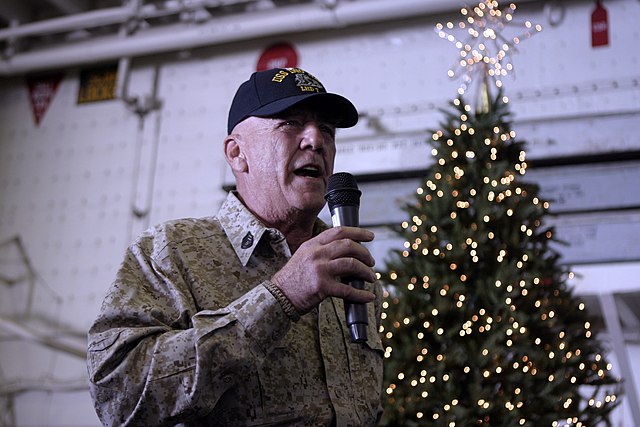 R. Lee Ermey speaking into a microphone