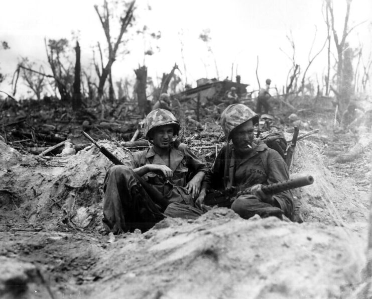 Two Marines taking a cigarette break