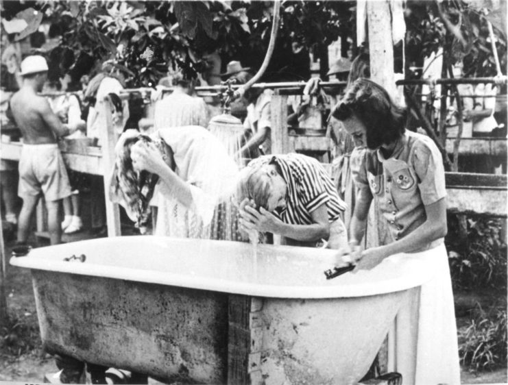 Women captives was their hair at the Santo Tomas internment camp in the Philippines