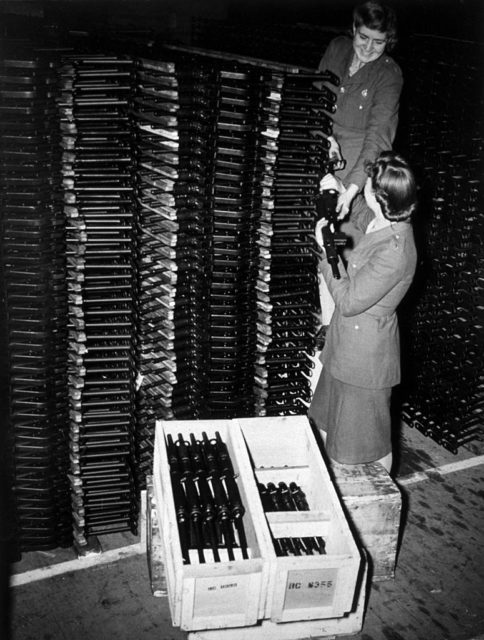 Two ordnance factory workers packing STEN submachine guns