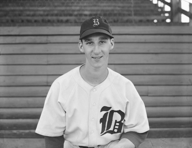 Warren Spahn posing for a photo in his Boston Braves uniform