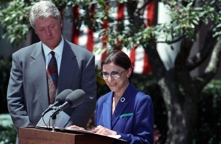 Bill Clinton standing next to Ruth Bader Ginsburg