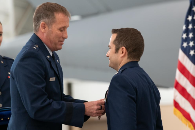 Maj. Gen. Matthew J. Burger presenting Lt. Col. Dominic Calderon with the Distinguished Flying Cross