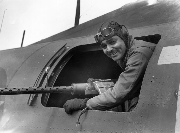 Clark Gable hanging out of an airplane