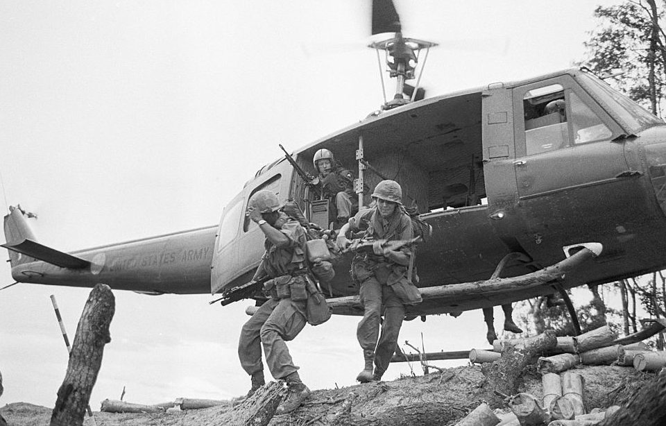 Soldiers jumping off a helicopter