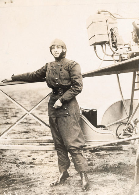 Marie Marvingt stands beside her airplane during the Femina Cup 