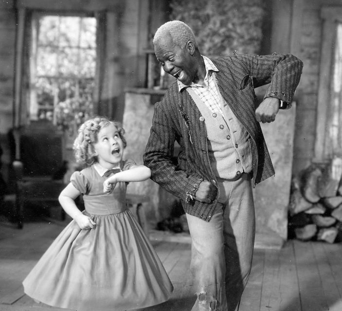 Shirley Temple and Bill "Bojangles" Robinson dancing together