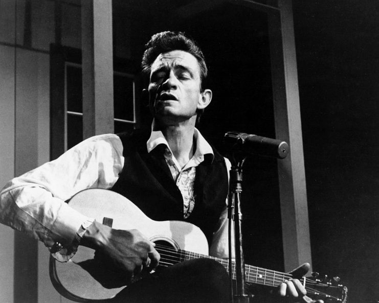 Johnny Cash performing on stage