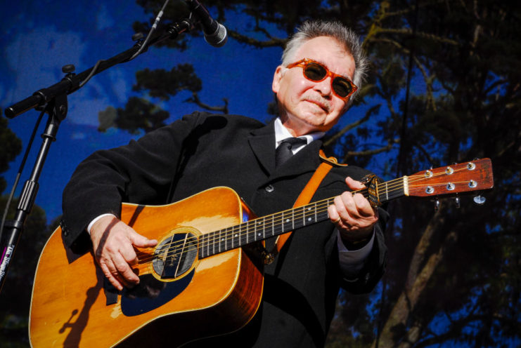 John Prine performing on stage