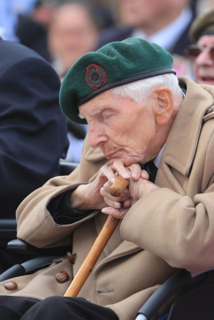 Horace 'Harry' Billinge leaning his head on his cane