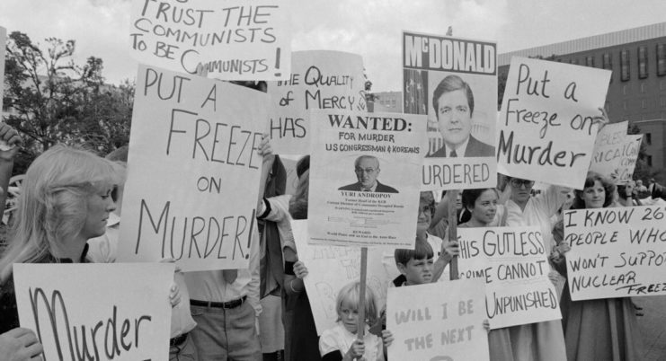 Protestors holding signs