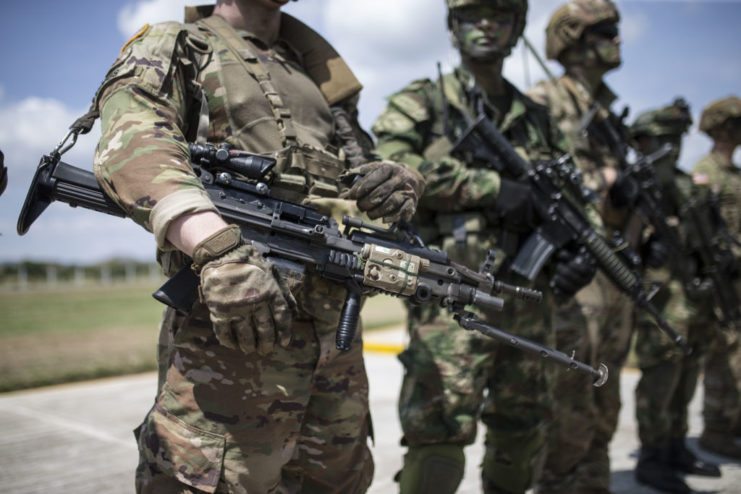 American soldier holding an M249 Squad Automatic Weapon