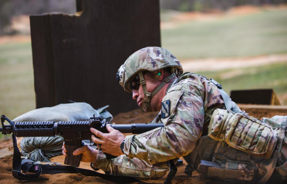 US soldier aiming an M4 Carbine