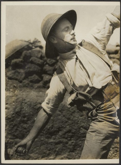 British Army officer preparing to throw a Mills bomb