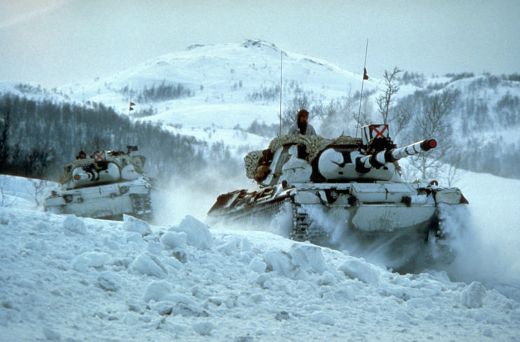 Two Leopard I tanks driving through snow