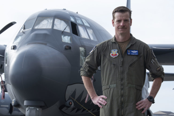 Col. Russell Cook standing in front of the HC-130J Combat King II