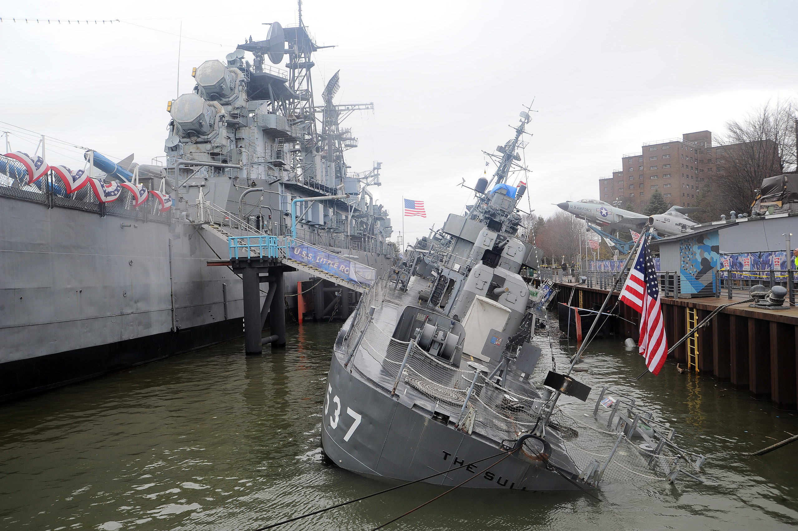 BUFFALO, NY - APRIL 14: The USS Sullivans lists in the Buffalo River on April 14, 2022 in Buffalo, New York. The Sullivans is a retired Fletcher class destroyer and was named in honor of five brothers (George, Francis, Joseph, Madison, and Albert) who lost their lives while on the USS Juneau when it was sunk by a Japanese submarine  during the naval battle of Guadalcanal on November 13,1942. (Photo by John Normile/Getty Images)