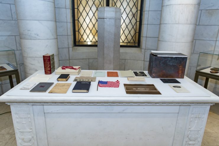 Various items dating back to 1915 placed on a desk