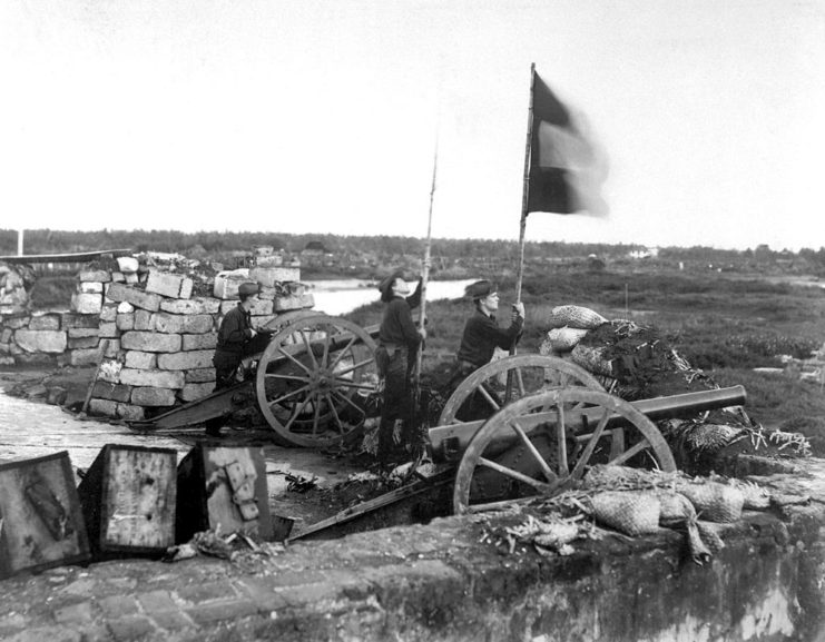 US soldier lowering the Spanish flag