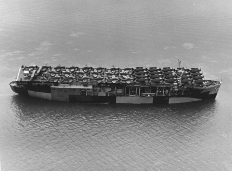 The USS Long Island departs from San Francisco carrying a full deck of fighter-planes.