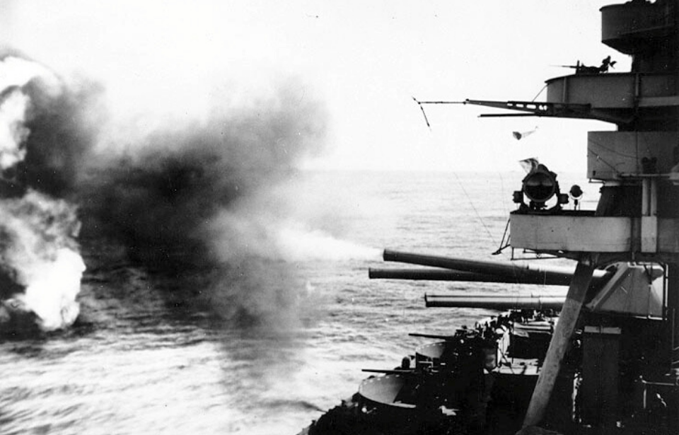 Naval guns firing on the deck of the USS New York (BB-34)