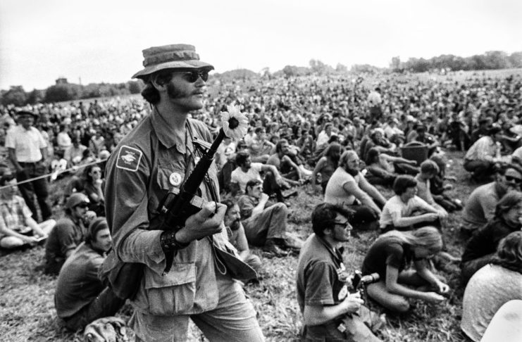 Vietnam War veteran holding a toy M-16 rifle