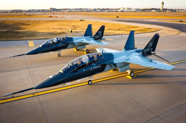 Two Boeing T-Xs parked on the runway