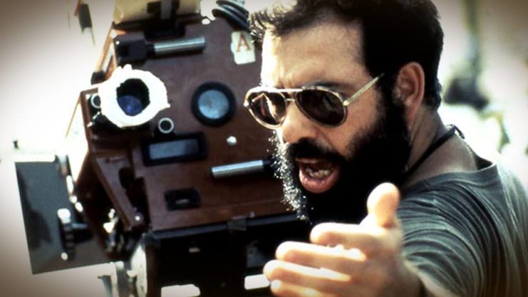 Francis Ford Coppola standing behind a camera