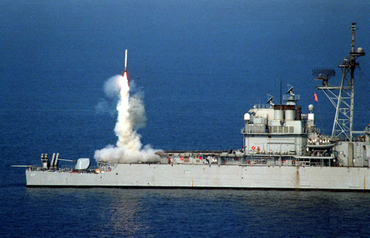 Tomahawk missile being launched from Navy ship.